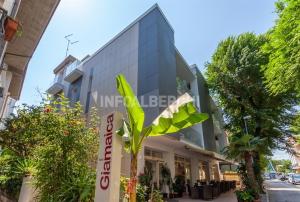 a building with a sign in front of it at HOTEL GIAMAICA in Cattolica