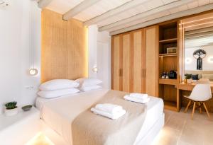 Postel nebo postele na pokoji v ubytování Hyperion Villa by LLB Mykonos