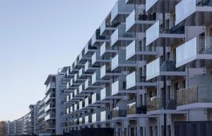 an external view of a building with glass balconies at Ein Katzensprung zum Meer - 3 Zi, 2 Bäder, Balkon in Binz