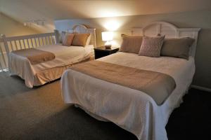 En eller flere senge i et værelse på Bay Colony 775