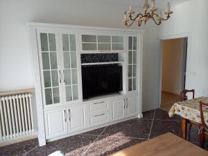 A television and/or entertainment centre at Serravalle Apartment