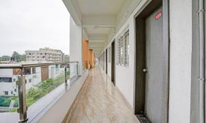 an empty corridor of a building with a balcony at Itsy Hotels Flowers Park in Nashik