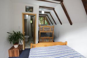 a bedroom with a bed and a chair in a room at Bungalows Ivona in Bastasi +121 photos