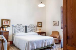 Postel nebo postele na pokoji v ubytování Baglio Spanò - Antiche Dimore di Sicilia