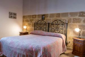 Voodi või voodid majutusasutuse Baglio Spanò - Antiche Dimore di Sicilia toas