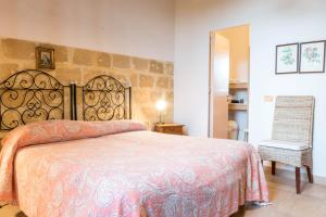 Postel nebo postele na pokoji v ubytování Baglio Spanò - Antiche Dimore di Sicilia