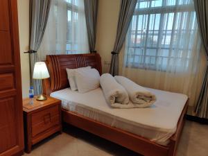 Een bed of bedden in een kamer bij FAD Home & Apartments