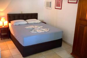 Postel nebo postele na pokoji v ubytování Hotel Pousada Rancho Fundo