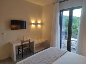 A bed or beds in a room at Yasemi
