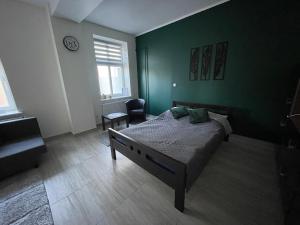 Łóżko lub łóżka w pokoju w obiekcie Apartamenty Trzciana