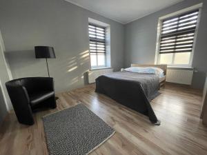 Łóżko lub łóżka w pokoju w obiekcie Apartamenty Trzciana