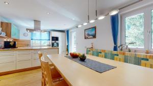 a kitchen with a table with an apple on it at Ferienwohnungen TANJA in Kappl
