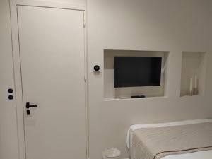 A bed or beds in a room at Yasemi
