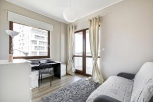 Llit o llits en una habitació de MG Apartments Giełdowa