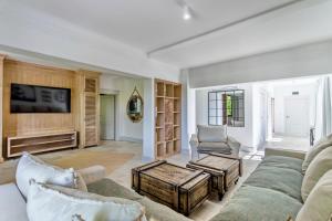 a living room with a couch and a table at Castro Mesembria Boutique Hotel in Nesebar