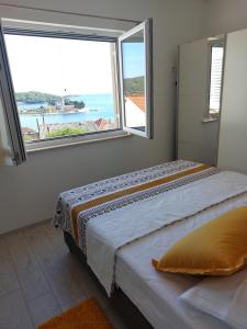 Postel nebo postele na pokoji v ubytování HOLIDAY HOME KATE