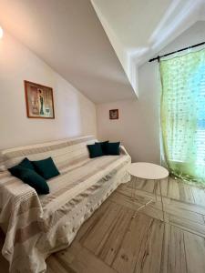 a bedroom with a large bed and a table at Gorana apartman with swimming pool in Jelsa +26 photos