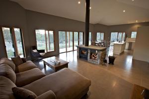 a living room with a couch and a fireplace at Snowy Wilderness in Ingebyra