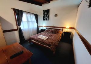 Cama ou camas em um quarto em Hostería Austral