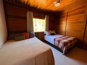 Llit o llits en una habitació de Rancho Nosso Lago