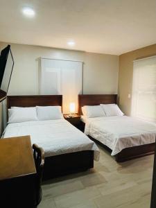 Un pat sau paturi într-o cameră la Apartamento Ganesha Liberia