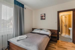 Posteľ alebo postele v izbe v ubytovaní Magdalenka 5 min pieszo od Kotelnicy