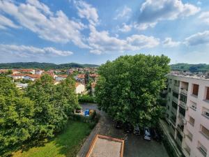 an aerial view of a city with trees at Apartma Vrtnica 5th floor in Nova Gorica