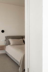 Postel nebo postele na pokoji v ubytování Monte Piccolo B&B