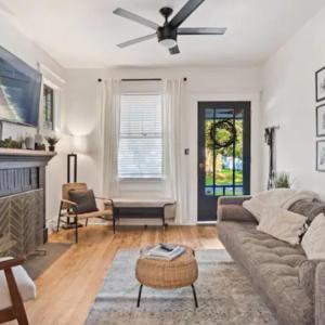 a living room with a couch and a ceiling fan at Family Vacation Home in Tampa, Florida in Tampa