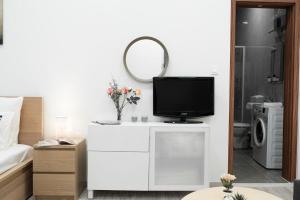 Televízia a/alebo spoločenská miestnosť v ubytovaní City Center Quiet Flat