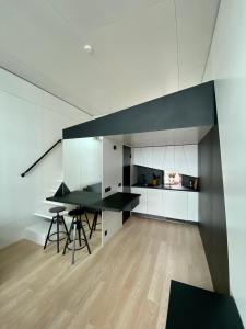 a kitchen with a table and chairs in a room at High end sea cabins at Å in Lofoten in Moskenes