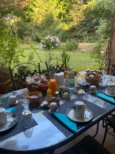 a table with a blue table cloth with food on it at B&B Borgo dei Fiori in Rozzano