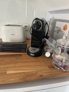 a counter with a blender and a toaster on it at B-Apartment Vienna 12 in Vienna