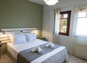 Кровать или кровати в номере Palmeira Sea & City