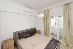 Postel nebo postele na pokoji v ubytování Naya Ixia Rhodes Apartment