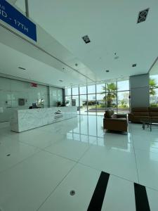 a lobby with a couch in a building at luxury studio with amazing seaview in Ras al Khaimah +25 photos