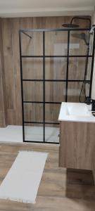 a bathroom with a sink and a shower at Casa Río Cañón in Meis +34 photos