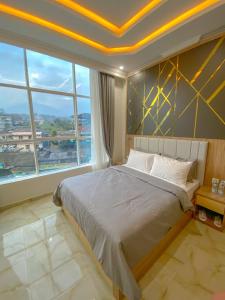 Postel nebo postele na pokoji v ubytování Algara Puncak Hotel + 37 fotografií