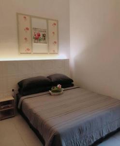 Letto o letti in una camera di Spring Fields Homestay by Sizma