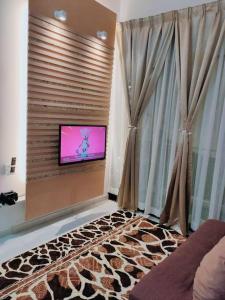 TV o dispositivi per l'intrattenimento presso Spring Fields Homestay by Sizma