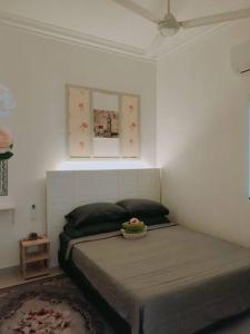 Letto o letti in una camera di Spring Fields Homestay by Sizma