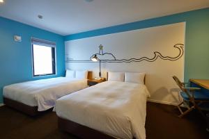 Postel nebo postele na pokoji v ubytování 8 Hotel Shonan Fujisawa