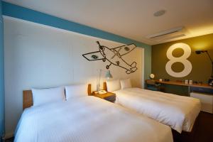 Postel nebo postele na pokoji v ubytování 8 Hotel Shonan Fujisawa