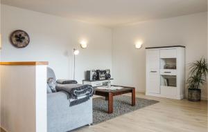 a living room with a couch and a table at Beautiful Apartment In Dillenburg With Kitchen in Dillenburg