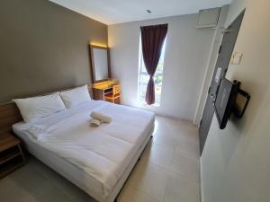 Ants Hotel客房内的一张或多张床位
