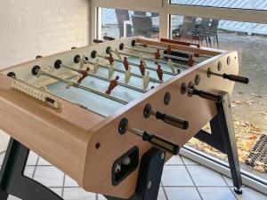 a large wooden foosball table in a room at 10 person holiday home in Glesborg in Fjellerup Strand