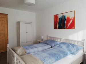 Postel nebo postele na pokoji v ubytování Erlhofer Apartments