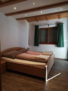 Posteľ alebo postele v izbe v ubytovaní Erlhofer Apartments