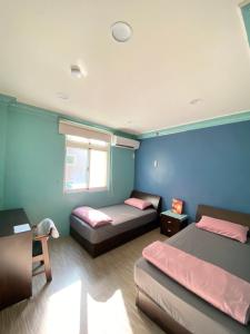 Postel nebo postele na pokoji v ubytování Myhome Homestay