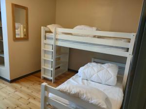 two bunk beds in a room with a mirror at LE BIEn Zen in Lebiez